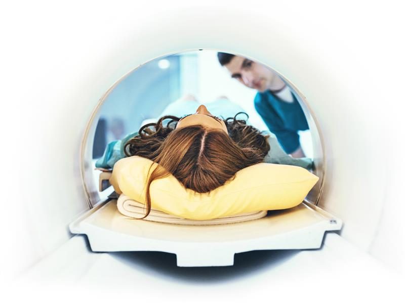A woman in an MRI machine