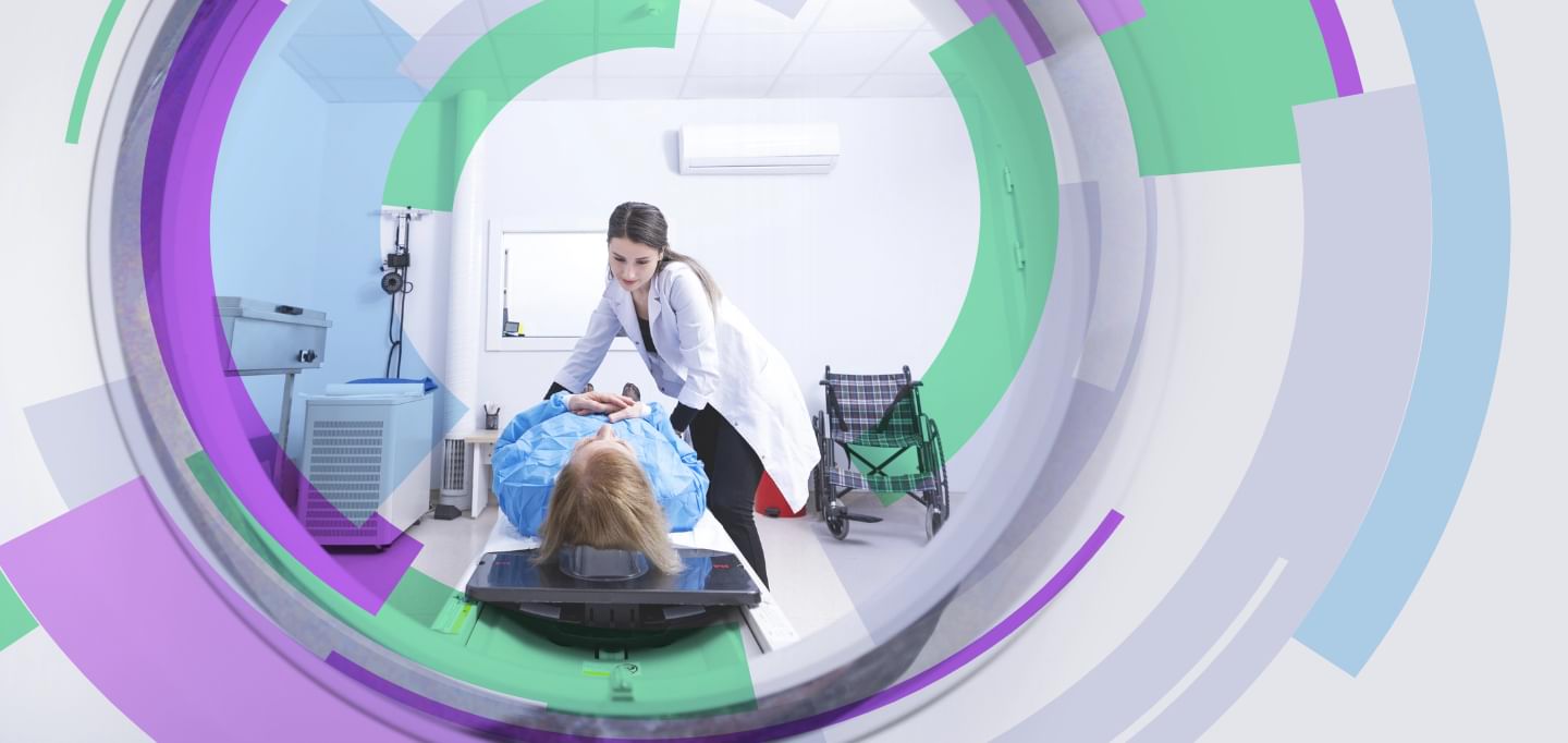 A doctor with a patient in an MRI machine